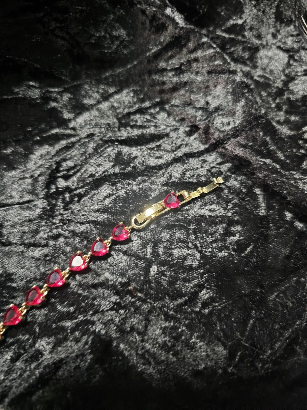 Gold-Plated Bracelet with Red Hearts Gemstones. Has a extender